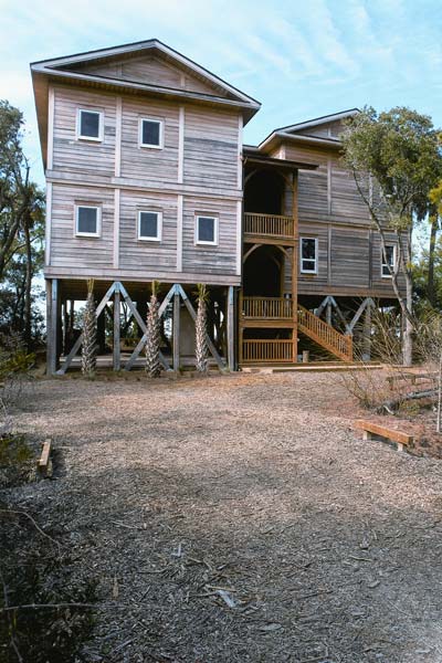 In their commitment to create a healthful, low-maintenance home, the Porrettos left the cypress siding unstained, allowing the home to weather to a lovely gray.